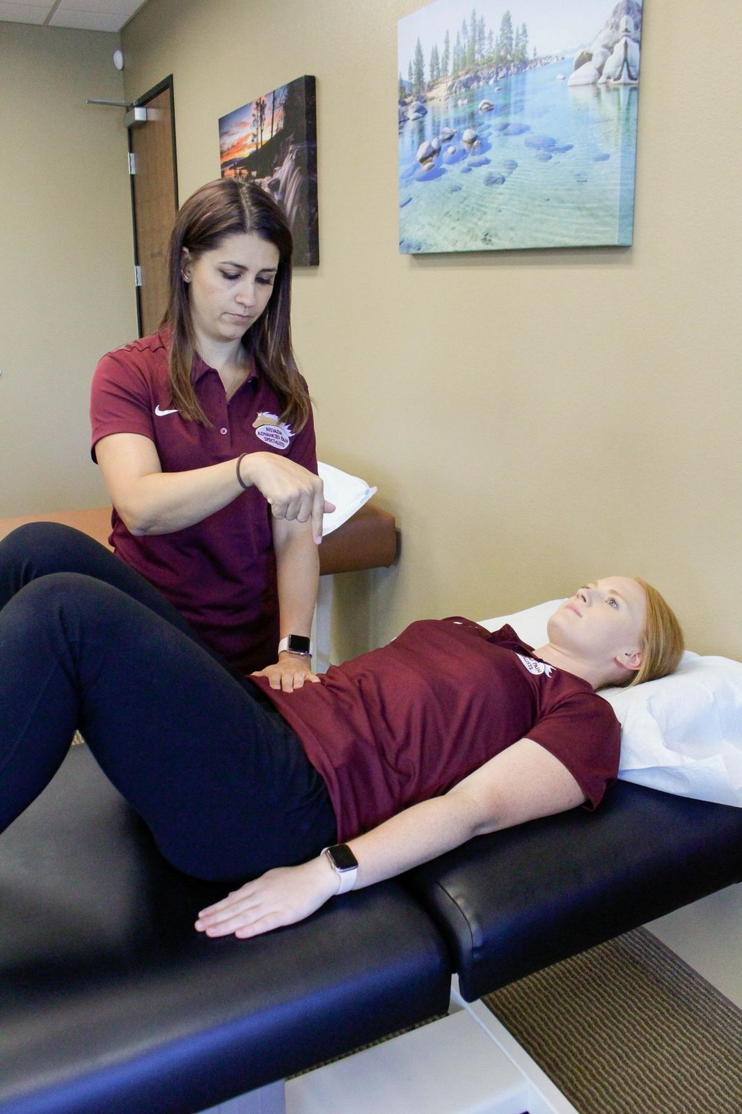 Therapist demonstrating the transverse abdominis contraction